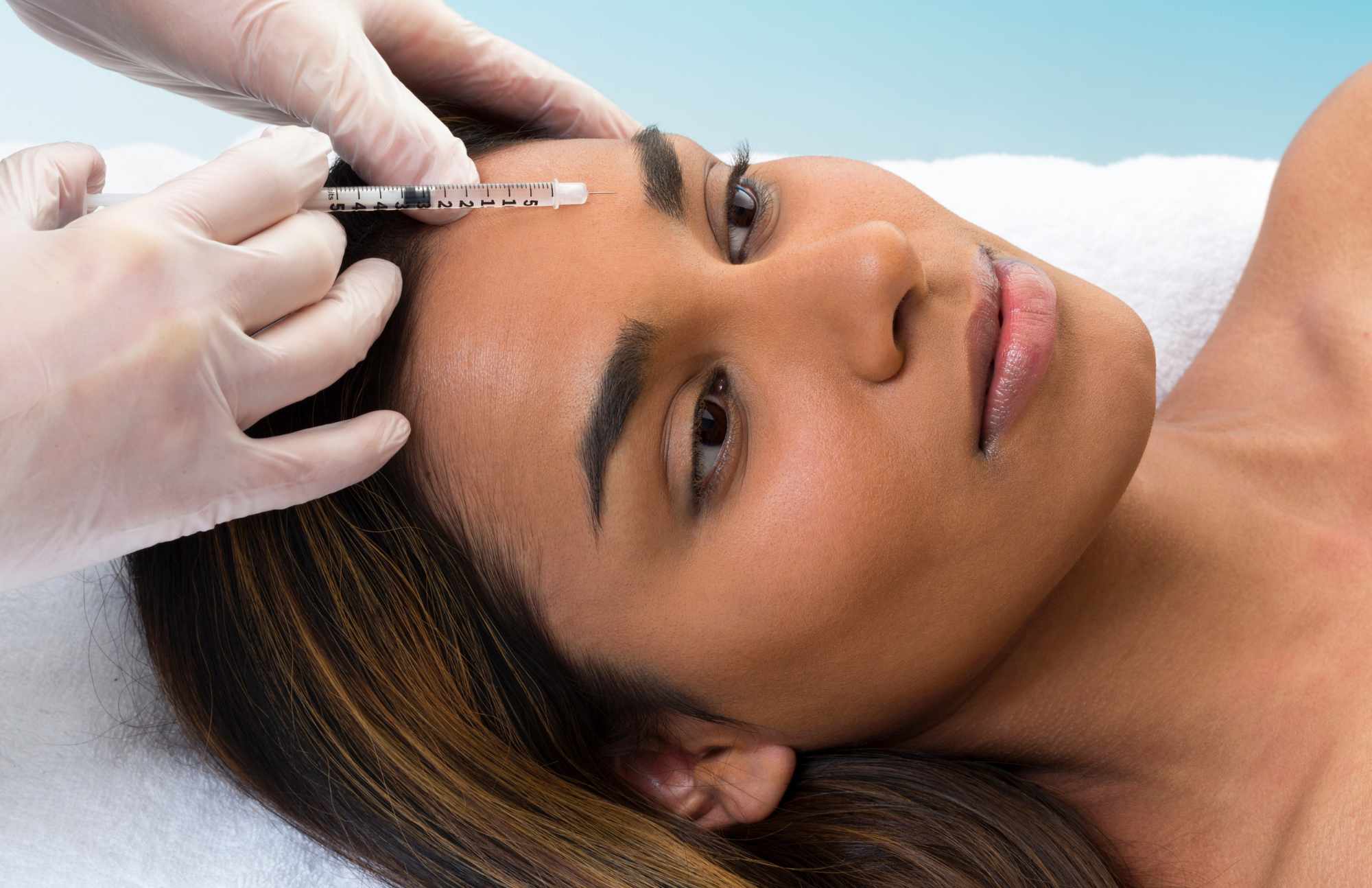 A woman receiving botox treatment