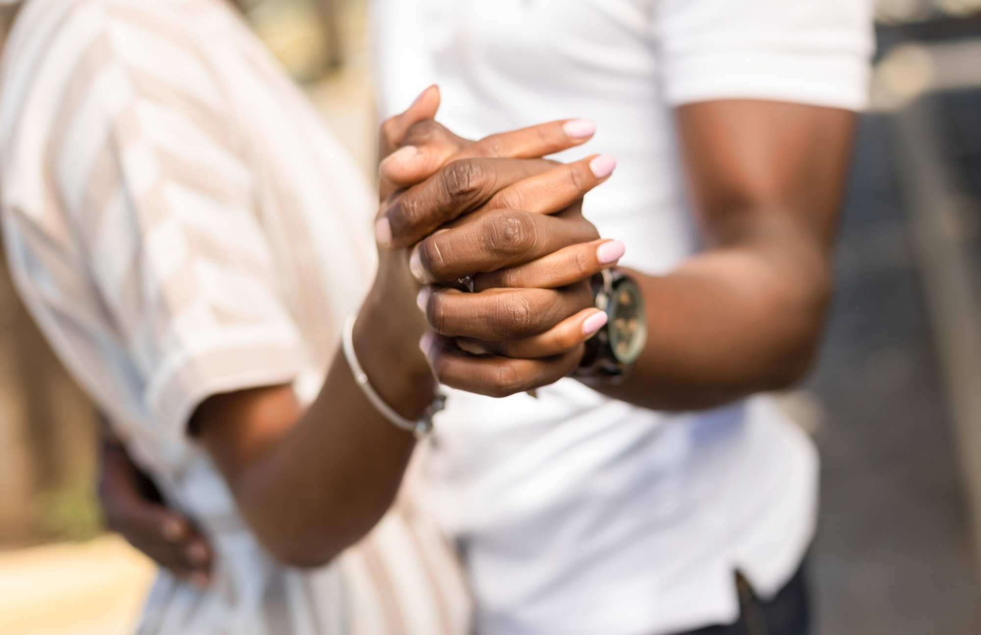 Close-up of hands with red marks, symbolizing the importance of STD testing and early detection for health and safety.