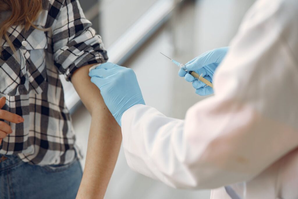 a doctor injecting the patient