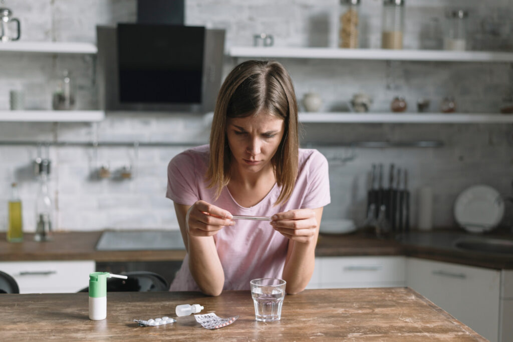 A girl in pain with the side effects of a medicine