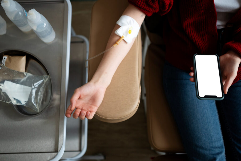 A man waiting for his IV drip to finish