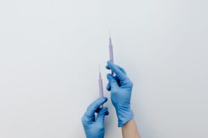 2 injections in the hands of a nurse